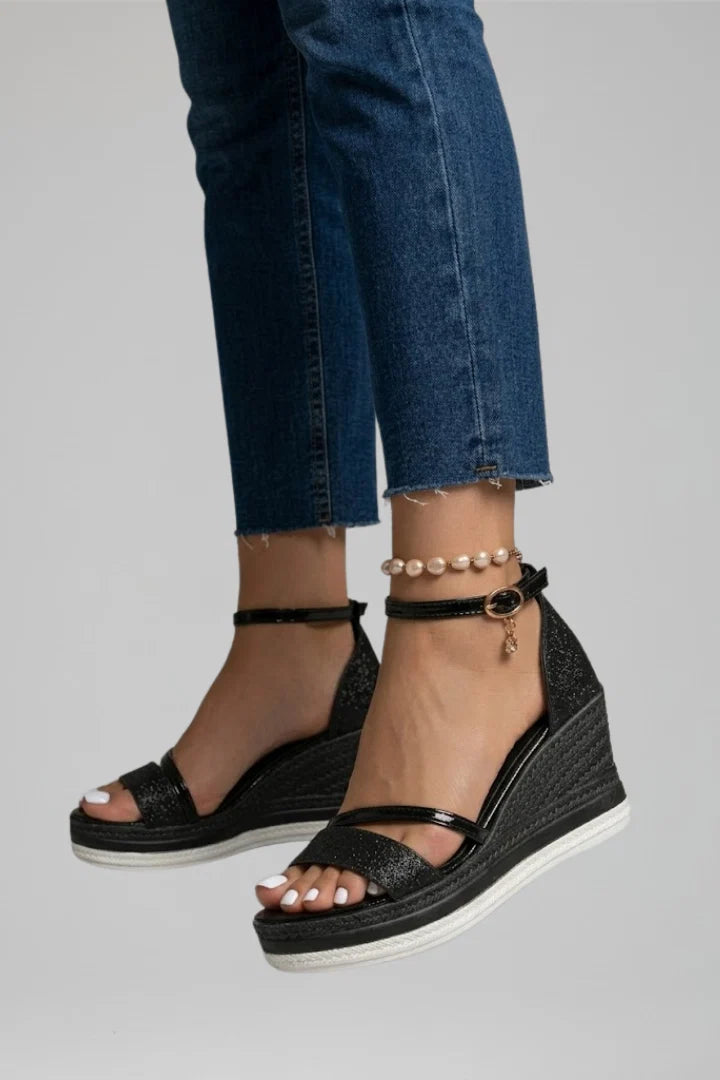 Women's open-toe wedge sandals featuring adjustable ankle strap and platform sole
