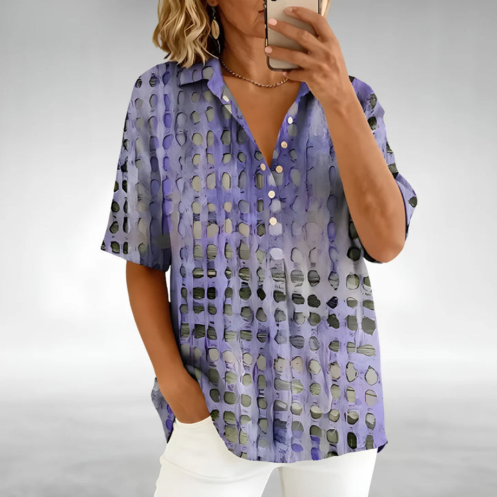 Side angle of the women's Relaxed Comfort Top displaying relaxed silhouette and curved hem
