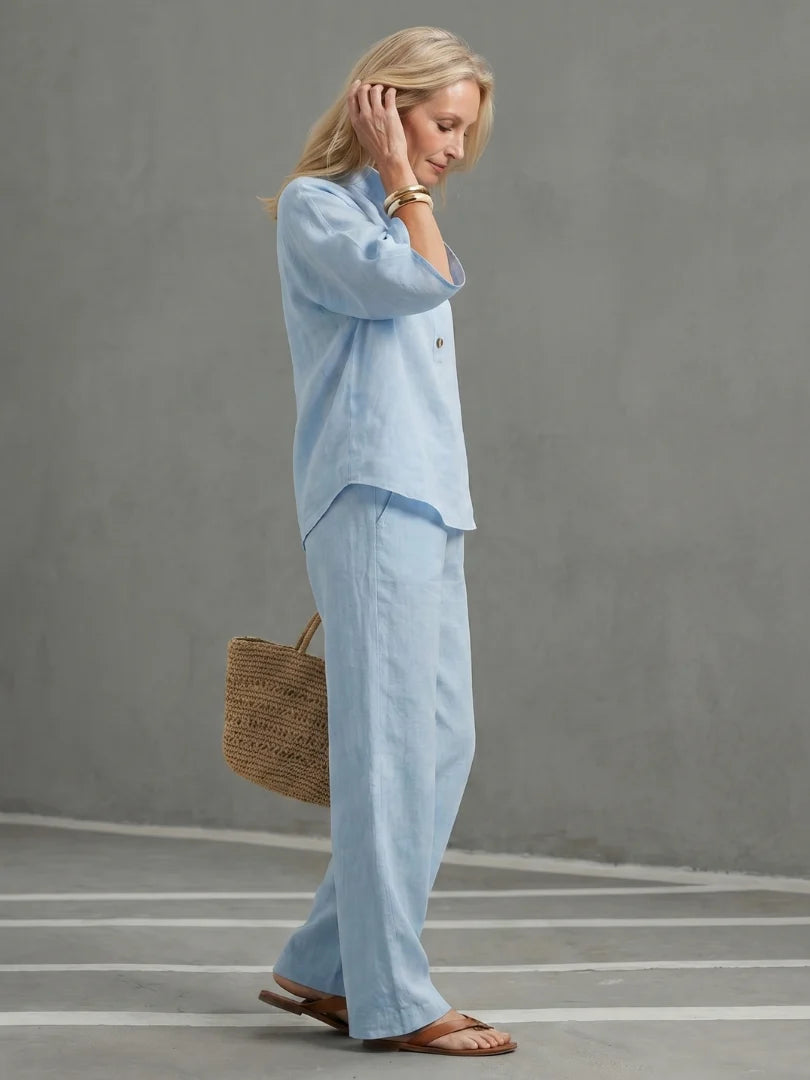 Relaxed fit two piece set featuring wide elbow-length sleeves and three-button placket detail