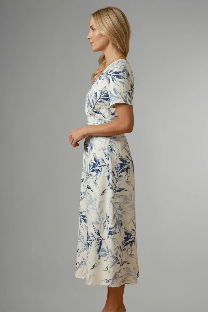 Women's floral print midi dress with V neckline and mid-length hemline in blue and white