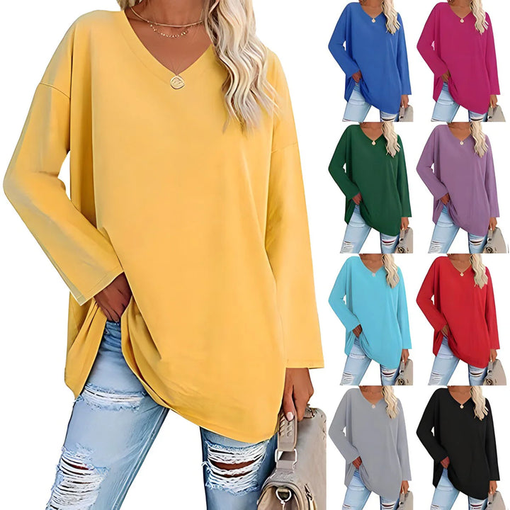 Women's V-Neck Long Sleeve Tunic in yellow with relaxed fit silhouette and curved hemline worn with light denim jeans