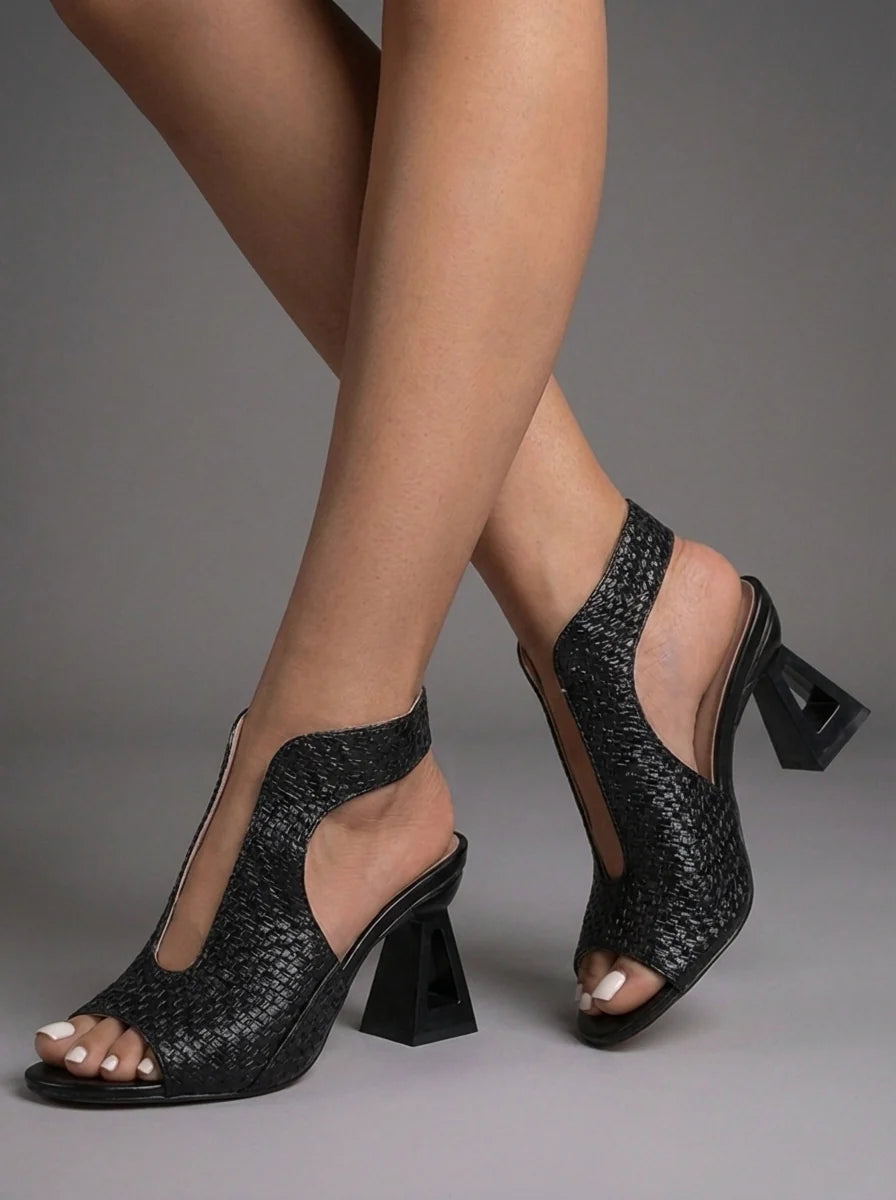 Side profile of Sienna sandals showing adjustable slingback strap and open-toe design