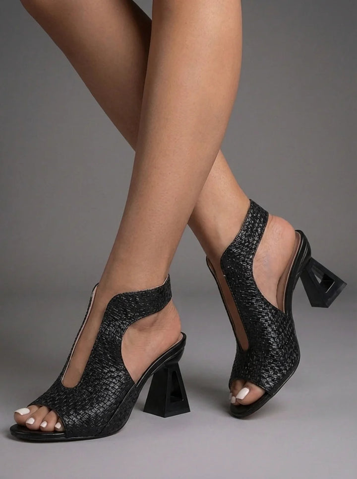 Side profile of Sienna sandals showing adjustable slingback strap and open-toe design