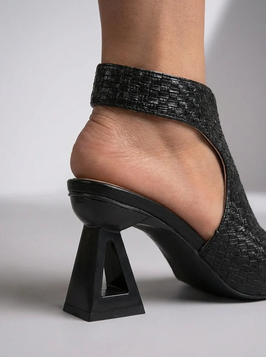 Detail shot of woven upper and structured heel on Sienna geometric heel sandals