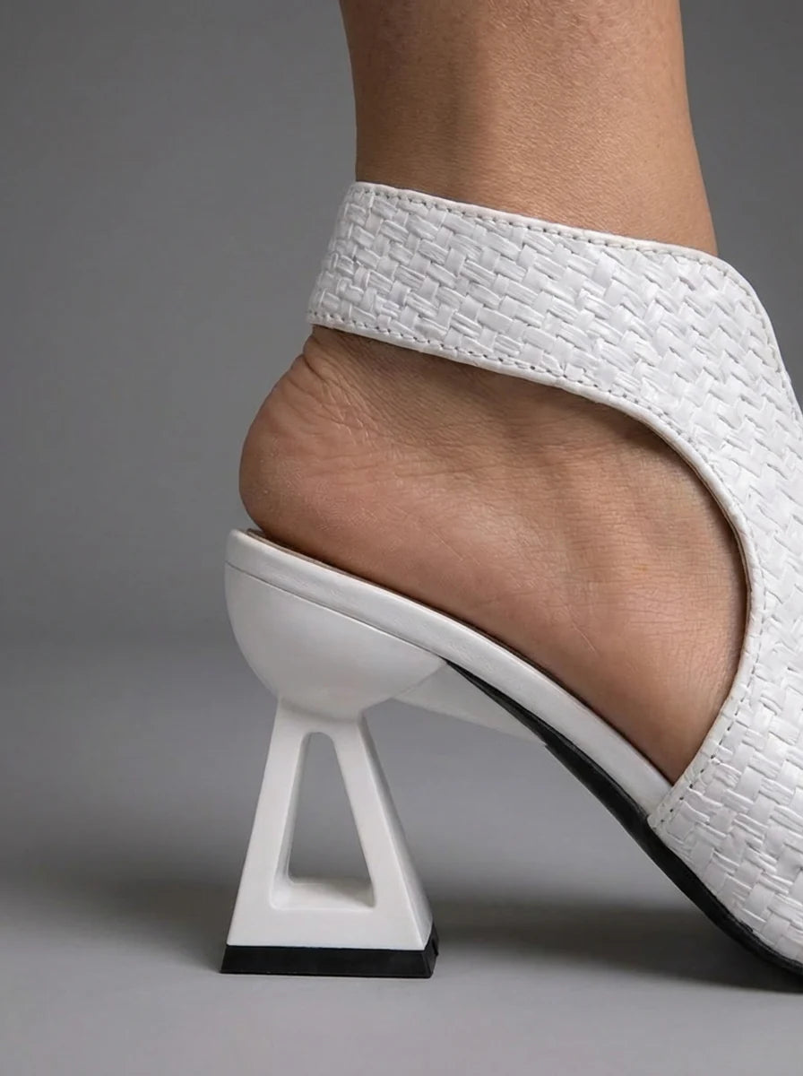 Close-up of Sienna sandals showing block heel structure and braided upper texture