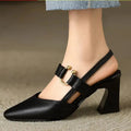 Black heels elegant slingback design with gold hardware detail and block heel on model