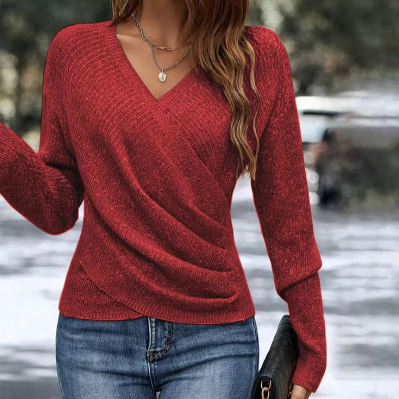 Side angle showing the fitted cut and long sleeves of the women's knit sweater