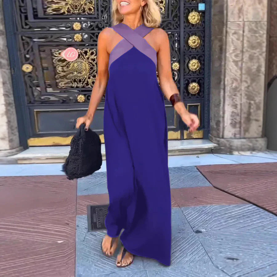 Halterneck maxi dress worn with casual styling for daytime outdoor event