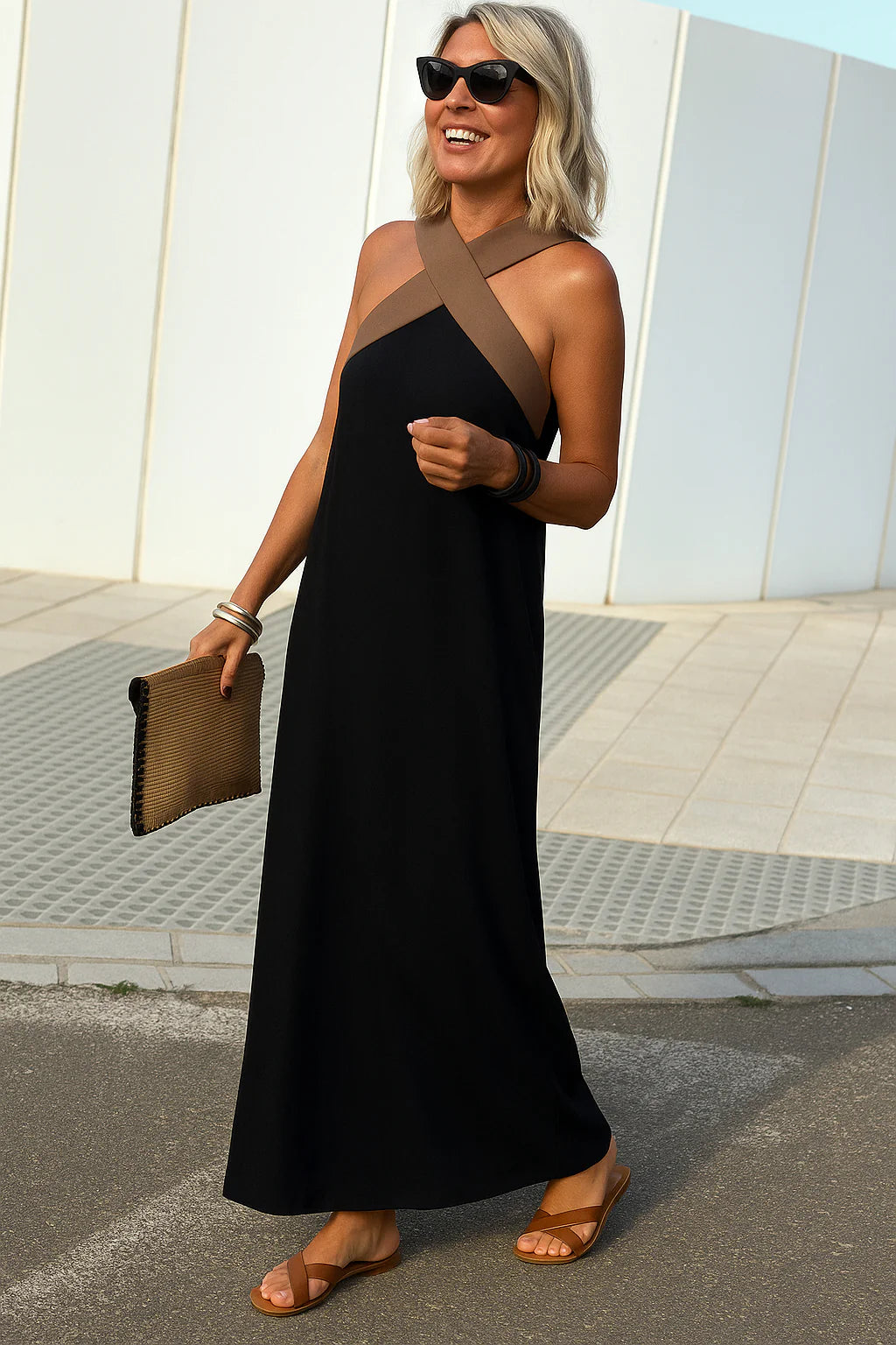 Woman in halterneck maxi dress demonstrating versatile styling for multiple occasions