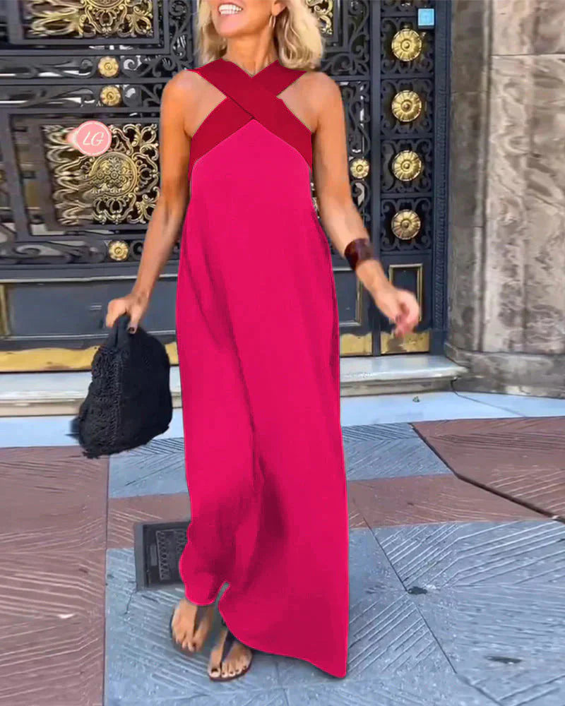 Woman wearing halterneck maxi dress styled with accessories for evening occasion