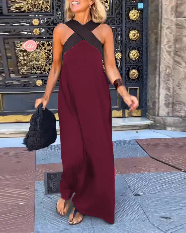 Movement shot of flowing halterneck maxi dress skirt with graceful drape