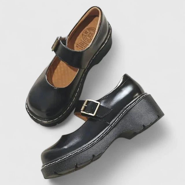 Close-up of buckle strap detail on women's platform Mary Jane shoes with contrast stitching