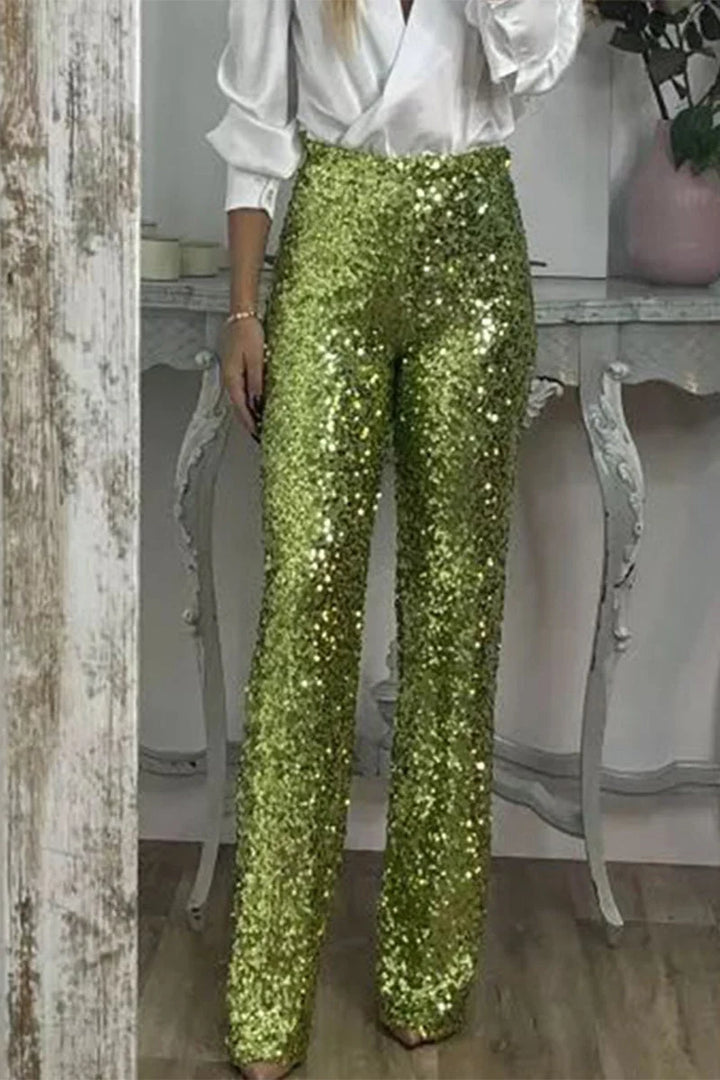 Close-up view of shimmering sequin finish on women's straight-leg party pants with elastic waistband detail
