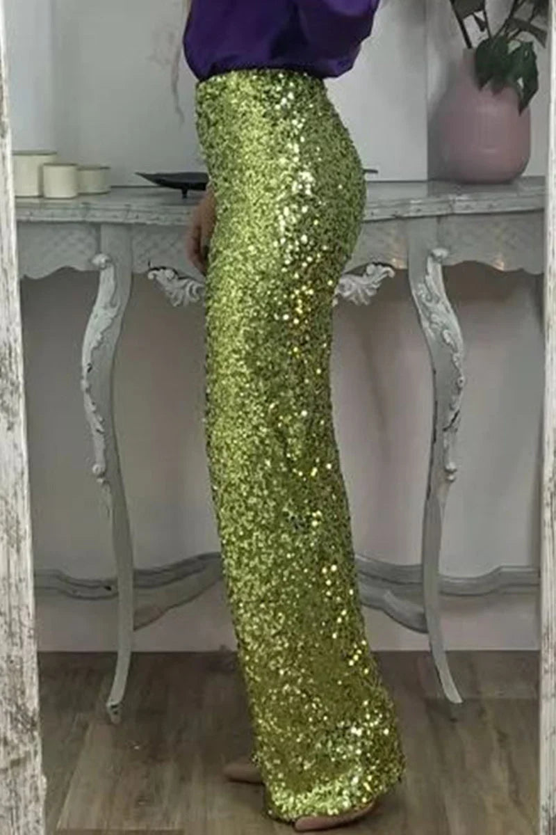 Full-length view of women's sequin straight-leg party pants paired with white blouse for evening styling