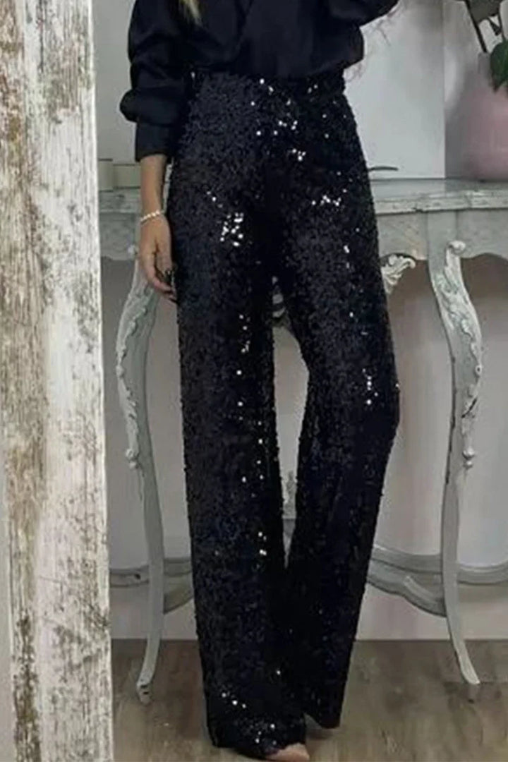 Back view of high-waist sequin straight-leg party pants for women showing comfortable fit and drape
