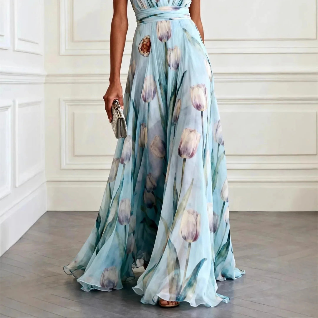 Side view of flowing maxi wrap dress showing pleated fabric and floor-length hem