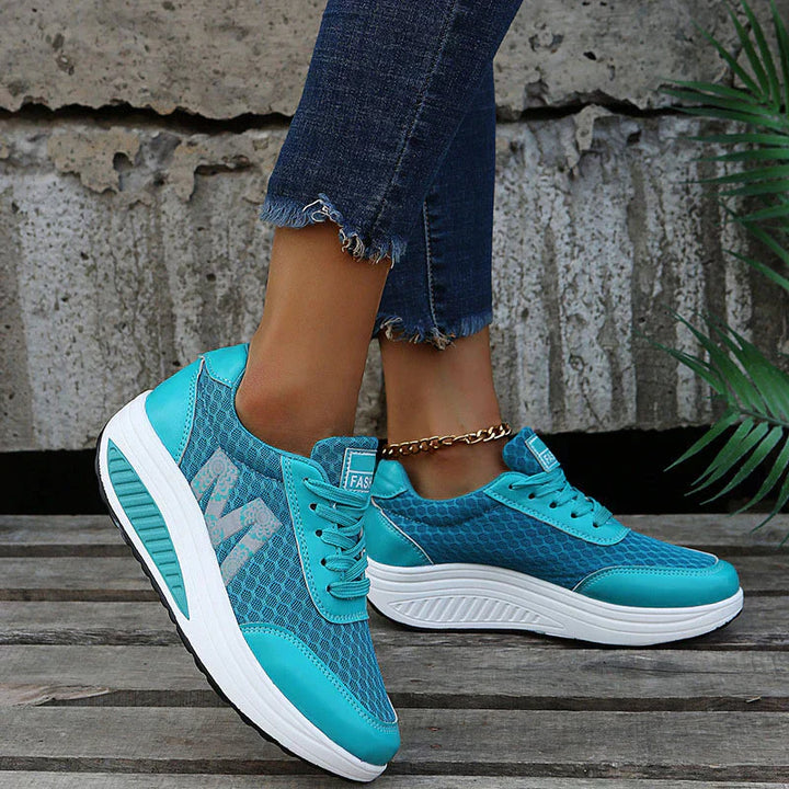 Full view of women's orthopedic walking sneakers with shock-absorbing sole and supportive construction