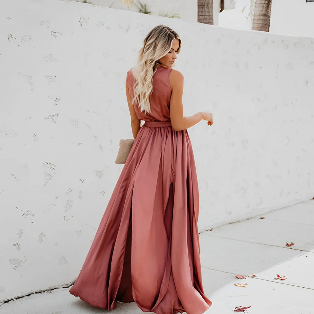Side view of sleeveless A-line maxi dress showing flowing silhouette and waist detail