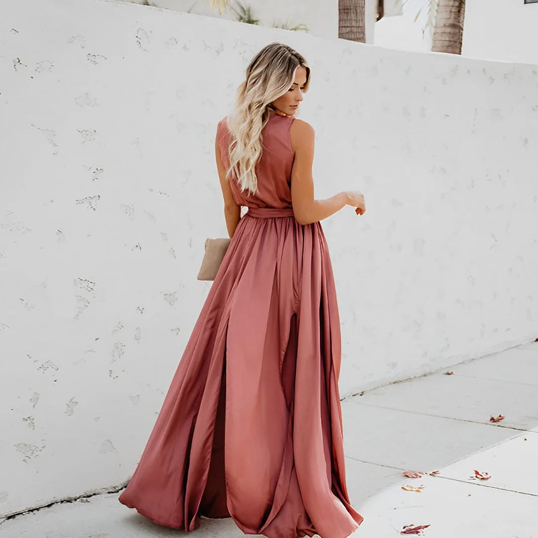 Side view of sleeveless A-line maxi dress showing flowing silhouette and waist detail