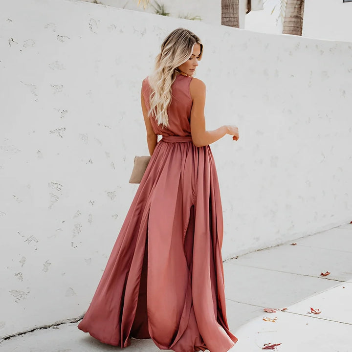Side view of sleeveless A-line maxi dress showing flowing silhouette and waist detail