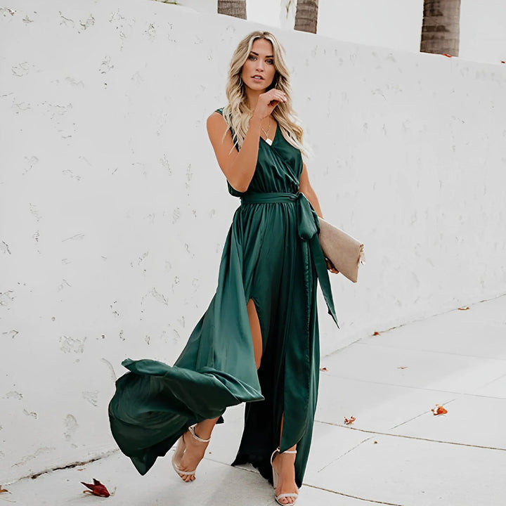 Close-up of tie waist detail on sleeveless maxi dress with smooth fabric drape