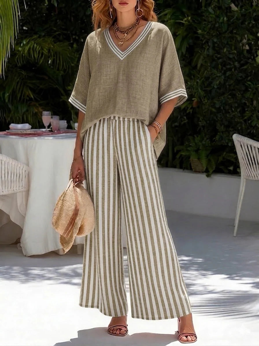 Back view of relaxed-fit V-neck top and wide-leg striped trousers in coordinated two-piece design